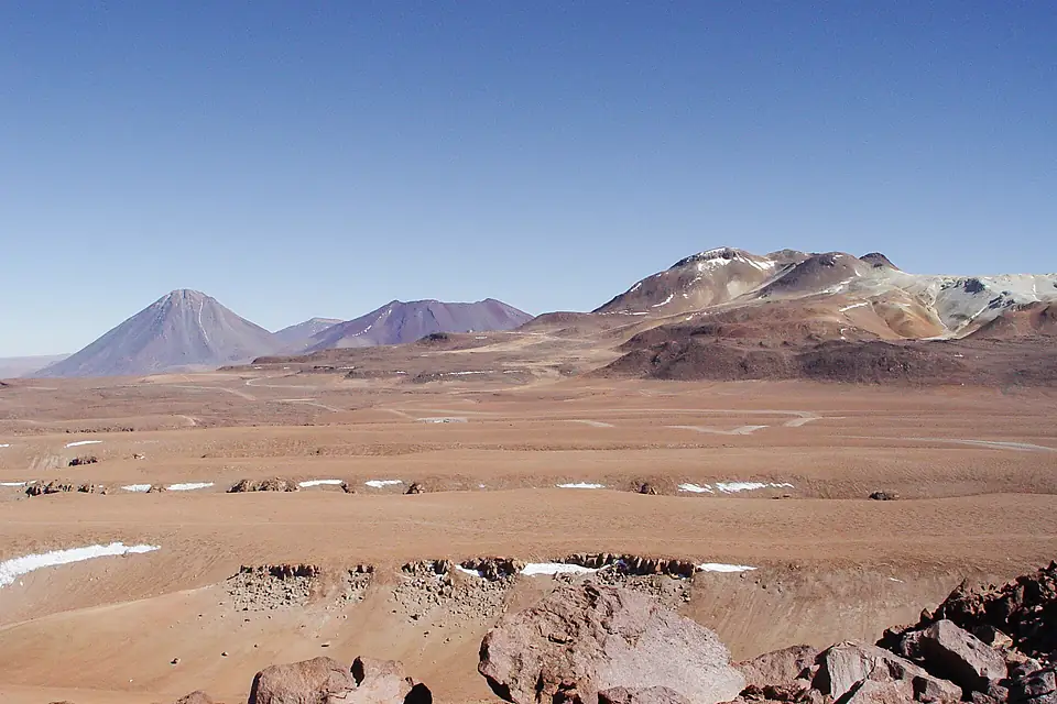 A view across the plains of Chajnantor with the ALMA construction site at the centre