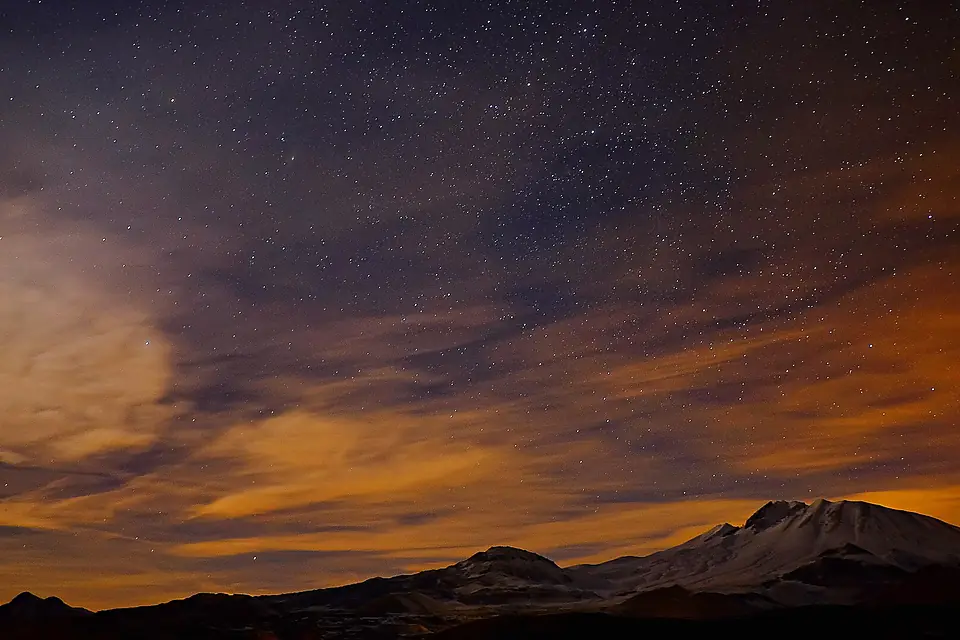 A mountain under the stars (Unsplash)