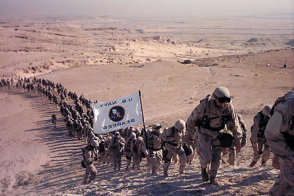 US Navy 021231-A-3447F-001 Seabees make their way up Mutla Ridge during a 7-mile march on New Year's Eve, 2002