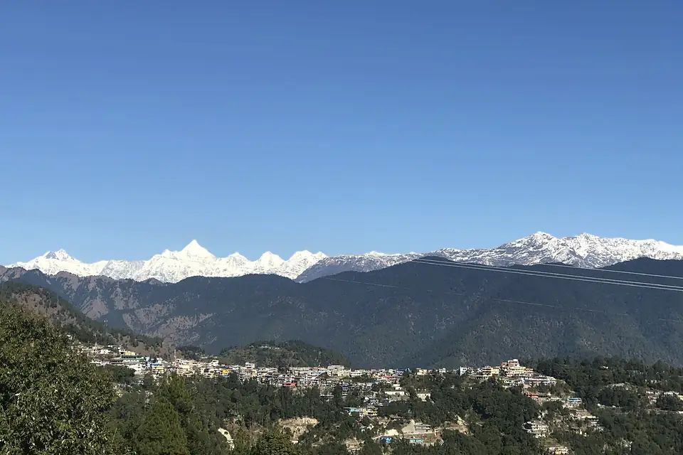 "Didihat Town and Panchachuli peaks in the background.jpg"
